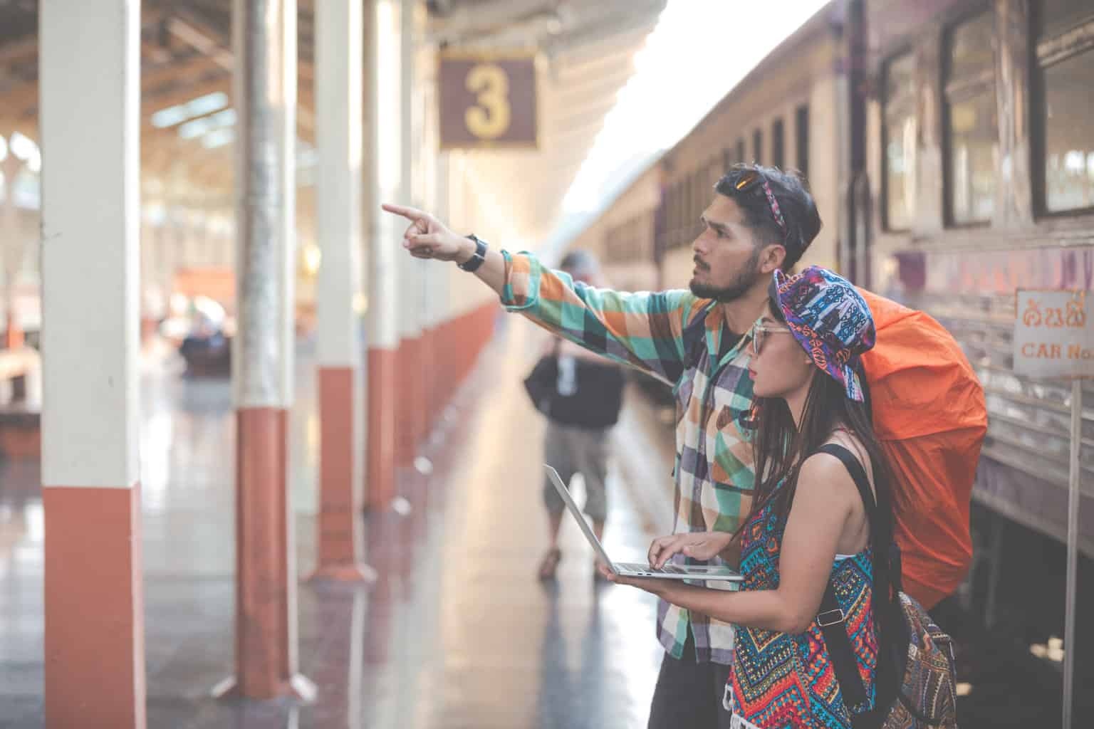 Tourists travel to the train station.